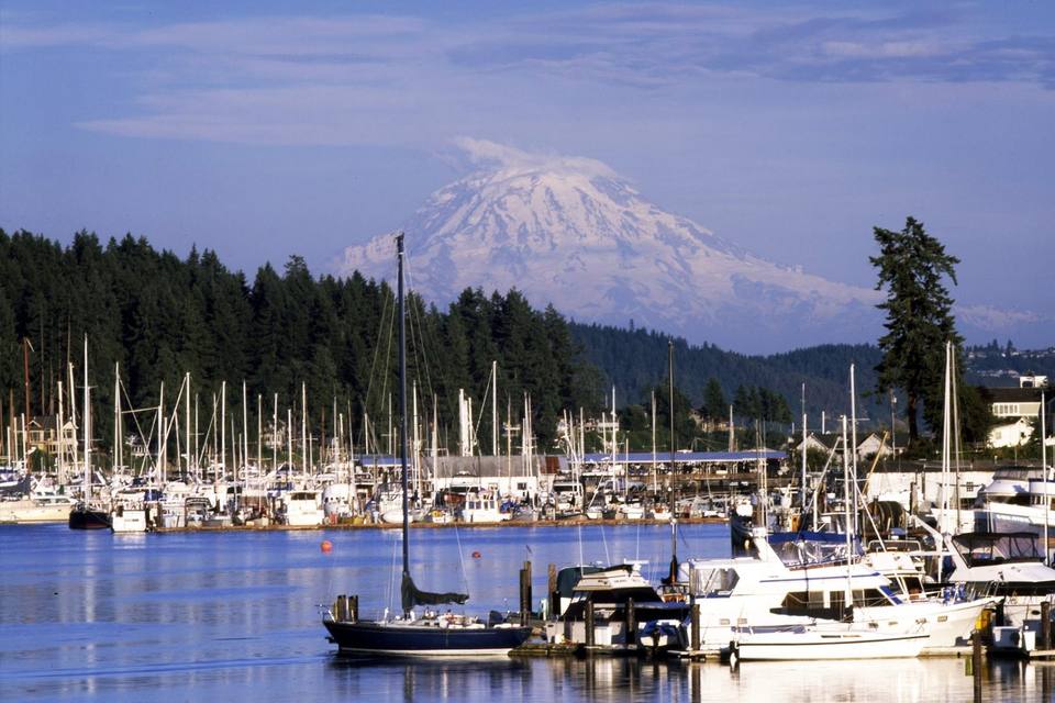 Sailboats in the Gig Harbor marina with Mount Rainier in the background